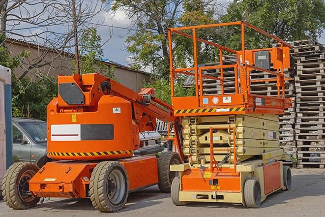 forklift transporting goods in a warehouse setting in Dedham, MA